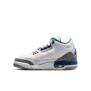 Youth white leather sneakers with angled side profile, blue trim, and elephant-print side panel