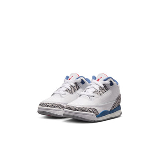 Toddler retro sneakers, white upper with blue swoosh, gray speckled detail, and red heel accents