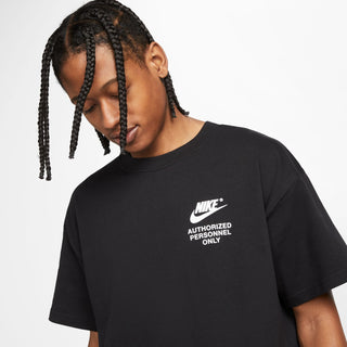 Black Nike t-shirt with front “Authorized Personnel Only” graphic, close-up