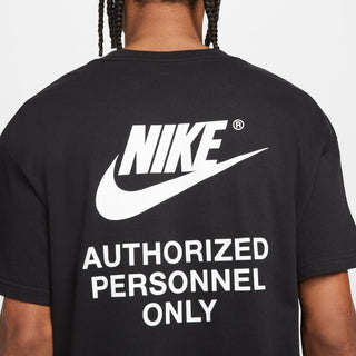 Back of black Nike t-shirt showing large “NIKE” logo and “Authorized Personnel Only”
