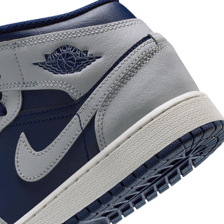 Close-up of youth sneaker side with Jordan wing logo and textured white outsole