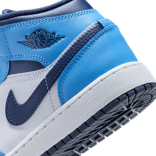 Close-up of youth mid-top sneaker side: Air Jordan wing logo on light blue leather