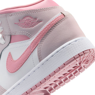 Youth mid-top sneakers, close-up; pearl pink leather upper with embroidered logo and pink trim.
