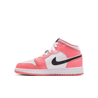 Youth AJ 1 mid-top sneaker with pink leather panels, black swoosh, and white laces