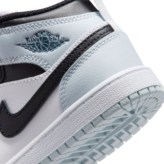 Kids sneaker side close-up with Air Jordan wing logo and textured sole