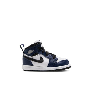 Toddler mid-top sneakers in white, navy, and dark gray with Nike swoosh and laces