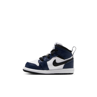 Toddler mid-top sneakers in white and navy with black laces and swoosh