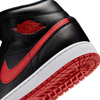 Close-up of black upper with Air Jordan wing logo, red trim, and white outsole