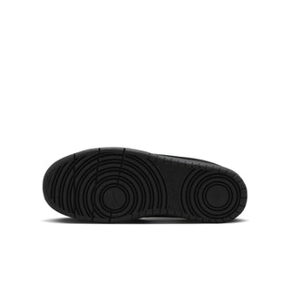 Youth black sneaker outsole with circular traction tread pattern