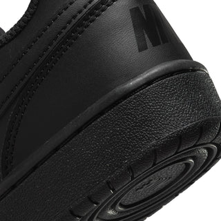 Youth black sneaker side detail with textured upper and molded midsole edge