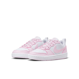 Pair of youth low-top sneakers, white uppers with pink overlays and lace-up