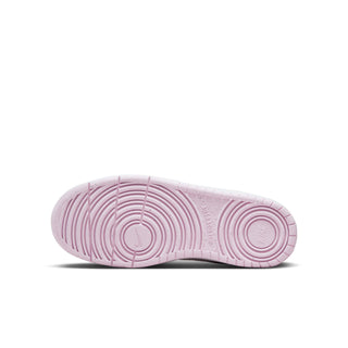 Youth sneaker outsole view, pink tread pattern on white rubber base