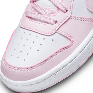 Youth sneaker upper close-up, white leather with pink trim and perforated toe