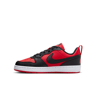 Youth low-top sneaker in red, black, and white, angled side view with black swoosh.