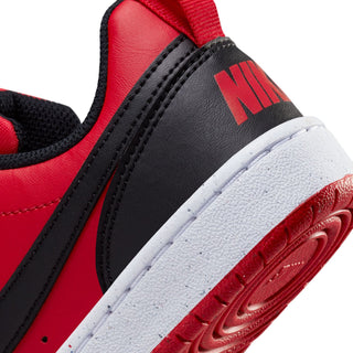 Close-up of youth red and black sneaker side with red logo detail and white midsole.