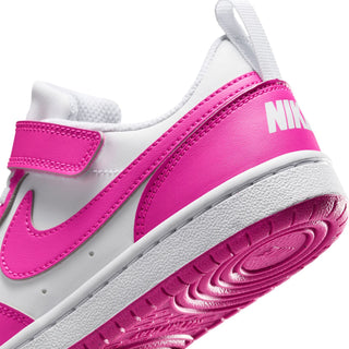 Kids sneaker side close-up with NIKE logo on pink panel and white midsole