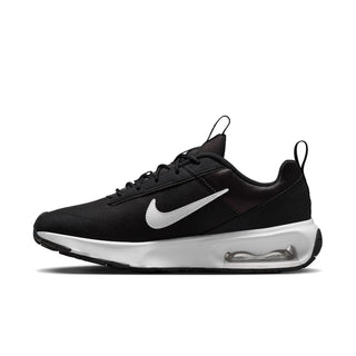Side view of black Nike Air Max INTRLK Lite sneaker with white Swoosh and visible air unit
