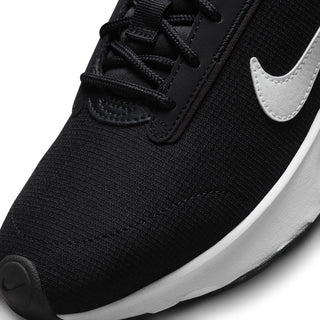 Close-up of black mesh Nike Air Max INTRLK Lite toe, laces, and white Swoosh