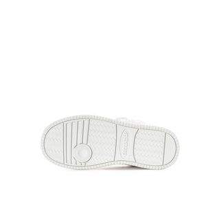 Kids' Hello Kitty sneaker outsole view, textured rubber tread on white base.