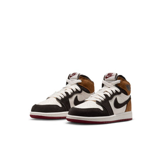 Pair of kids high-top sneakers with white panels, black swoosh and brown overlays
