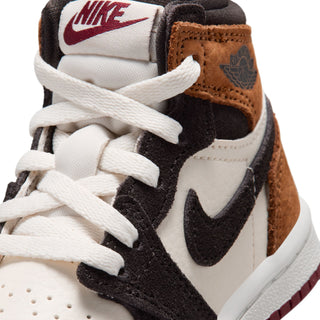 Close-up of toddler high-top laces and Nike Swoosh on white and black panels