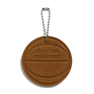 Brown circular keychain tag with text "Respect" and silver ball chain
