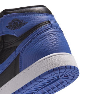 Close-up of youth high-top sneaker heel, blue leather overlay and white midsole