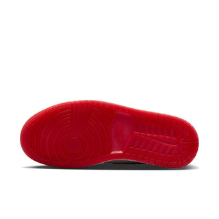Red rubber outsole of high-top sneaker with tread pattern