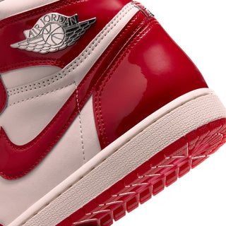 Close-up of high-top sneaker side: Air Jordan wings logo on red-and-white