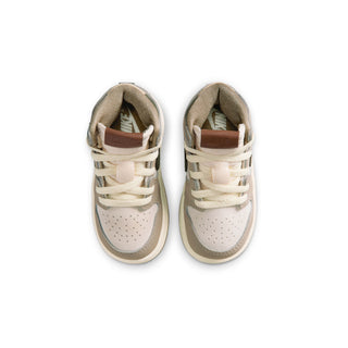 Toddler high-top sneakers viewed from above, showing cream laces and perforations