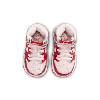 Toddler high-top sneakers viewed from above, red and white with lace-up closure