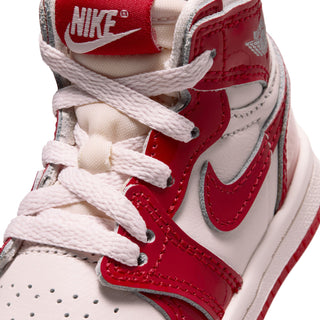 Close-up of toddler high-top sneaker tongue and laces in red and white