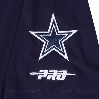 Midnight-blue T-shirt close-up of white star graphic with 'PRO' mark