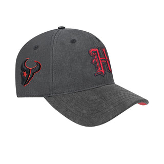 Washed black Texans strapback cap with red trophy icon and “H” logo