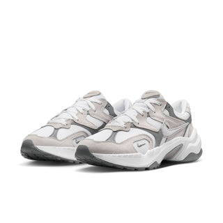 White and gray lace-up sneakers, side view, with textured panels and thick midsole