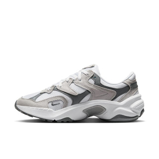 White and gray women’s sneakers, angled side view, with swoosh and layered panels