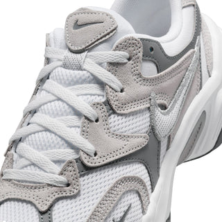 Close-up of white and gray sneaker upper with laces, perforated texture, and swoosh