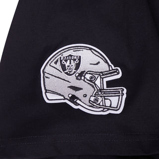 Close-up of helmet-and-helmet Raiders logo patch on black T-shirt