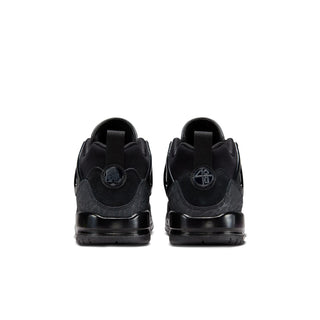 Youth black sneakers from heel view, with pull tab and rubber cup sole