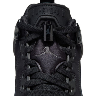 Close-up front view of youth black sneakers, laces over tongue with logo detail