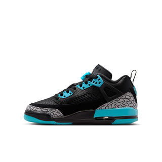 Youth low-top sneakers side view in black with grey print and aqua eyelets