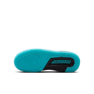 Youth low-top sneaker outsole in aqua with Jordan logo on black center