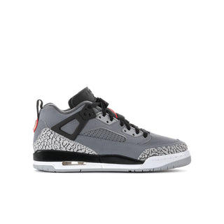 Youth low-top sneakers in cool grey with black accents, red hits, and speckled panels