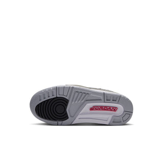 Kids' outsole view of low-top sneakers with gray traction tread and Jordan logo mark.