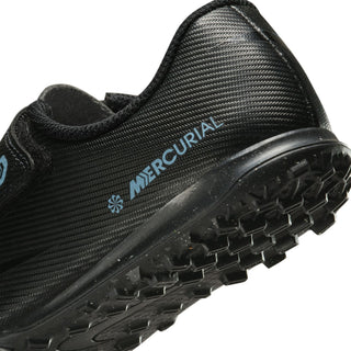 Kids soccer cleat heel close-up, black lining with MERCURIAL text and blue detail