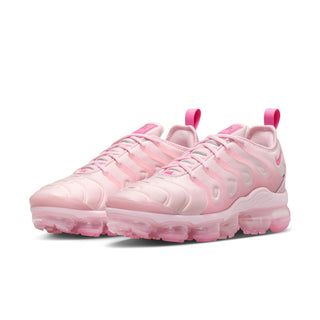 Women's pink lace-up sneakers with molded cushioning details and translucent air sole