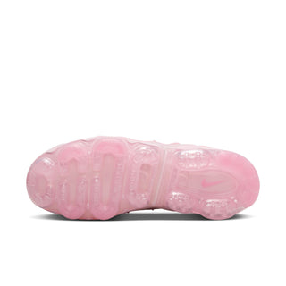 Pink women's sneakers outsole view with visible traction pods and translucent midsole