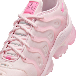 Close-up of pink women's sneaker upper with lace rows and molded cushion shapes