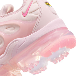 Close-up of pink women's sneaker heel and translucent air sole with Nike swoosh