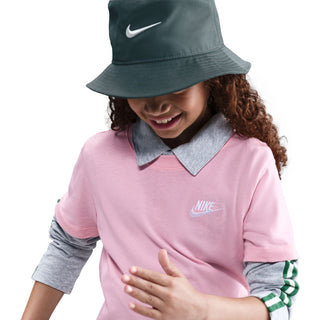 Youth pink tee with embroidered Nike logo, close-up of front